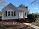 Gray sided house with brick base, steps leading to covered porch at 1426 Hilltop St, Albemarle, NC 28001