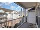 View from a balcony overlooking townhouses, parking, and a blue sky at 14967 Santa Lucia Dr, Charlotte, NC 28277