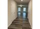 Bright hallway with wood-look floors, leading to the living room at 155 Trail Wood Ct, Salisbury, NC 28146