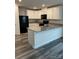 Kitchen island with granite countertop and white cabinets at 155 Trail Wood Ct, Salisbury, NC 28146