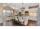 Modern kitchen with white cabinets, granite countertops, and an island at 176 Broadleaf Dr, Denver, NC 28037