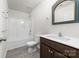 Bathroom with a single vanity, a shower, and a decorative mirror at 17909 Wilbanks Dr, Charlotte, NC 28278