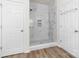 Elegant bathroom with a large, frameless shower with marble tile at 17909 Wilbanks Dr, Charlotte, NC 28278