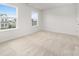 Bright bedroom with neutral carpeting and two large windows at 17909 Wilbanks Dr, Charlotte, NC 28278