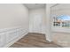 Bright entryway with wood-look floors and wainscoting at 17909 Wilbanks Dr, Charlotte, NC 28278