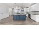 Modern kitchen with white cabinets and blue island at 17909 Wilbanks Dr, Charlotte, NC 28278