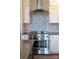 Stainless steel appliances and a stylish backsplash highlight this modern kitchen at 17909 Wilbanks Dr, Charlotte, NC 28278