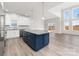 Modern kitchen with blue island and stainless steel appliances at 17909 Wilbanks Dr, Charlotte, NC 28278