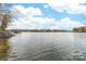Scenic lake view with houses and trees in the background at 17909 Wilbanks Dr, Charlotte, NC 28278
