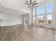 Open living space with hardwood floors, vaulted ceiling and access to deck at 17909 Wilbanks Dr, Charlotte, NC 28278