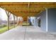 Covered patio with stairs leading to backyard, offering extra outdoor space at 17909 Wilbanks Dr, Charlotte, NC 28278