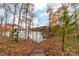 Wooden stairs descending to the lake, with fall foliage backdrop at 17909 Wilbanks Dr, Charlotte, NC 28278