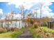 Wooden walkway to the lake, surrounded by autumn foliage at 17909 Wilbanks Dr, Charlotte, NC 28278