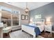 Bright bedroom with a queen-size bed and backyard view at 19411 Greentree Way, Cornelius, NC 28031