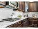 Kitchen detail with white subway tile backsplash and granite countertops at 19411 Greentree Way, Cornelius, NC 28031