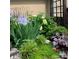 Well-manicured garden with irises and peonies at 19411 Greentree Way, Cornelius, NC 28031