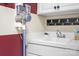 Laundry room with utility sink and wall-mounted vacuum at 19411 Greentree Way, Cornelius, NC 28031