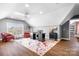 Home office with wood floors and two red armchairs at 19411 Greentree Way, Cornelius, NC 28031