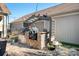 Built-in outdoor kitchen with stone and stainless steel finishes at 19411 Greentree Way, Cornelius, NC 28031