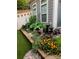 Landscaped side yard with flowers and small fountain at 19411 Greentree Way, Cornelius, NC 28031