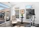 Bright sunroom with seating area and access to backyard at 19411 Greentree Way, Cornelius, NC 28031