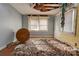 Bedroom in need of repair, with damaged ceiling, debris, and wood floors at 2021 Willis Dr, Shelby, NC 28152