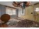 Bedroom in need of repair, with damaged ceiling, debris, and wood floors at 2021 Willis Dr, Shelby, NC 28152