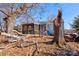Exterior of home with covered porch and mature trees on an overgrown lot at 2021 Willis Dr, Shelby, NC 28152