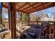 Covered porch with wood railings and an assortment of patio furniture at 2021 Willis Dr, Shelby, NC 28152