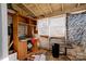Interior showing an unfinished room with a desk, shelving, and an animal print at 2021 Willis Dr, Shelby, NC 28152