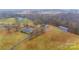 Aerial view of the property and surrounding acreage with a detached garage at 20329 Efird Rd, Albemarle, NC 28001