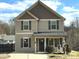 Tan two-story house with gray accents, shutters, and a front porch at 212 Old Centergrove Rd # 111, Kannapolis, NC 28083