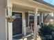Dark brown front door with sidelights and a welcoming 
