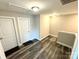 Upstairs hallway with wood-look flooring and two bedroom doors at 212 Old Centergrove Rd # 111, Kannapolis, NC 28083