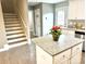 Kitchen island with granite countertop and a floral centerpiece at 212 Old Centergrove Rd # 111, Kannapolis, NC 28083