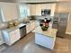 Modern kitchen with white cabinets, granite counters, and stainless steel appliances at 212 Old Centergrove Rd # 111, Kannapolis, NC 28083