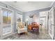 Sunroom with French doors leading to the backyard at 227 Point Wylie Ln, Fort Mill, SC 29708