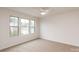 Bright bedroom with neutral carpeting and multiple windows at 2323 Glenway Trail Ct, Pineville, NC 28134