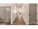 Bright hallway with light walls and wood flooring at 2323 Glenway Trail Ct, Pineville, NC 28134