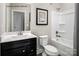 Clean bathroom with bathtub and dark vanity at 2521 Ellen Ave # 1015D, Charlotte, NC 28208