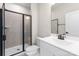 Bathroom with black shower, white vanity, and modern lighting at 3036 Arbor Ash St # 1022B, Charlotte, NC 28208