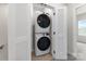 Laundry closet with stacked washer and dryer, and shelving at 3036 Arbor Ash St # 1022B, Charlotte, NC 28208