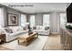 Bright living room filled with natural light, modern furniture, and neutral decor at 3036 Arbor Ash St # 1022B, Charlotte, NC 28208