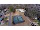 Aerial view showing community tennis courts, swimming pool and surrounding homes at 308 N Hawthorne St, Mount Holly, NC 28120