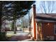 Rear home exterior surrounded by mature trees and yard, providing a private and serene atmosphere at 308 N Hawthorne St, Mount Holly, NC 28120