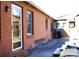 Brick back home exterior showcasing the patio, windows and exterior door at 308 N Hawthorne St, Mount Holly, NC 28120