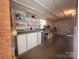 Finished basement with built-in cabinetry, ample storage space, and practical workspace at 308 N Hawthorne St, Mount Holly, NC 28120