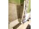 Bathroom view displaying the tub and shower with elegant, bright tile and contrasting dark flooring at 308 N Hawthorne St, Mount Holly, NC 28120