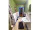 Bathroom view displaying the stylish pedestal sink, mirror, and fixtures with white-painted wood paneling at 308 N Hawthorne St, Mount Holly, NC 28120