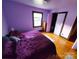Bedroom features hardwood floors and a spacious closet at 308 N Hawthorne St, Mount Holly, NC 28120